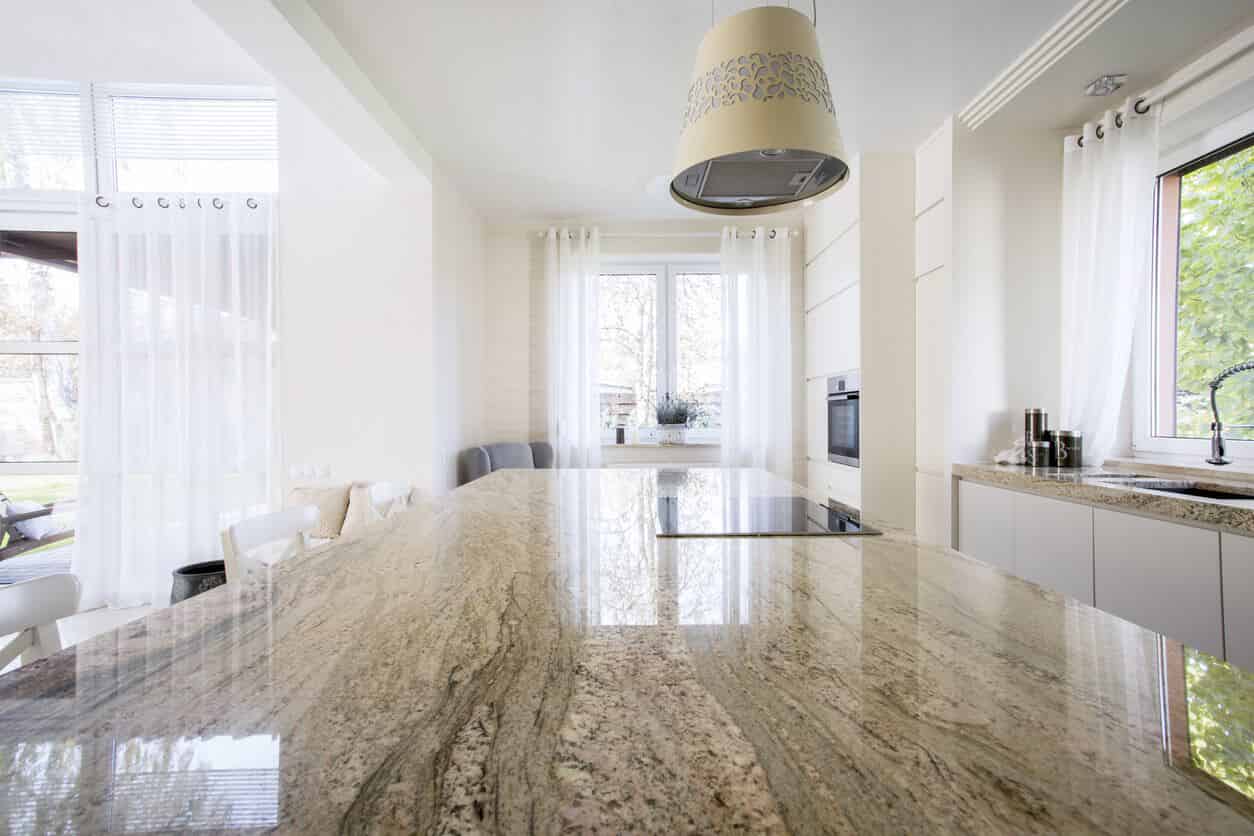 view of a clean home kitchen from marble countertop