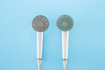 Dirty and clean shower heads side-by-side