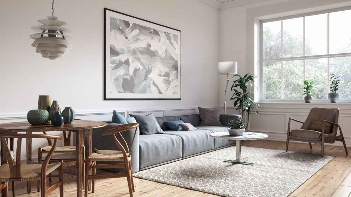 meticulously clean living room with grey couch, small dining table, and large window 