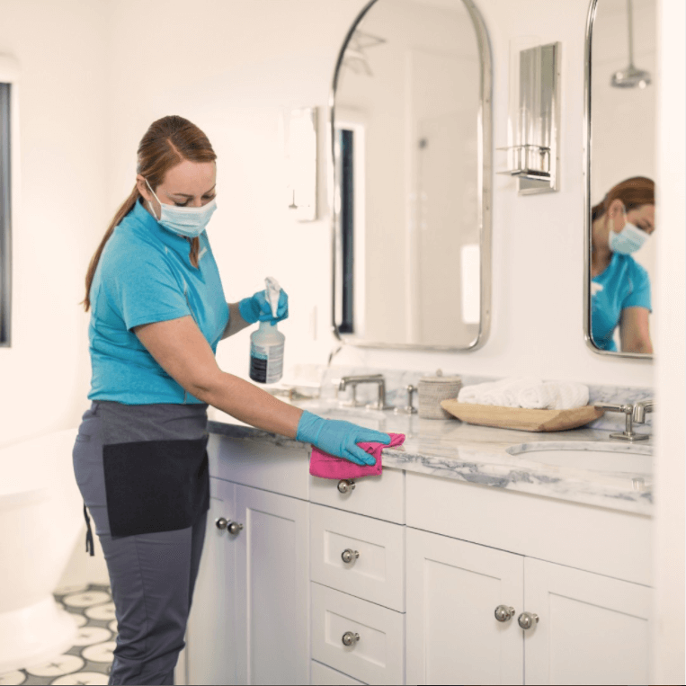 Merry Maids house cleaning professional providing detailed cleaning services
